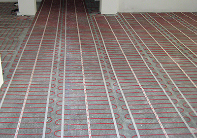 ComfortTile floor heating mats being installed